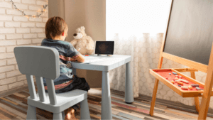 A child works on homework in a room inspired by fall painting ideas!